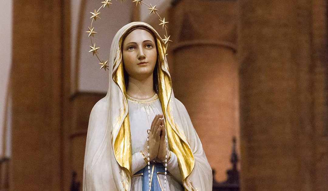 Statue of Our Lady or Lourdes with Rosary.